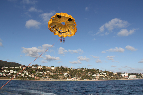 having fun parasailing far shot