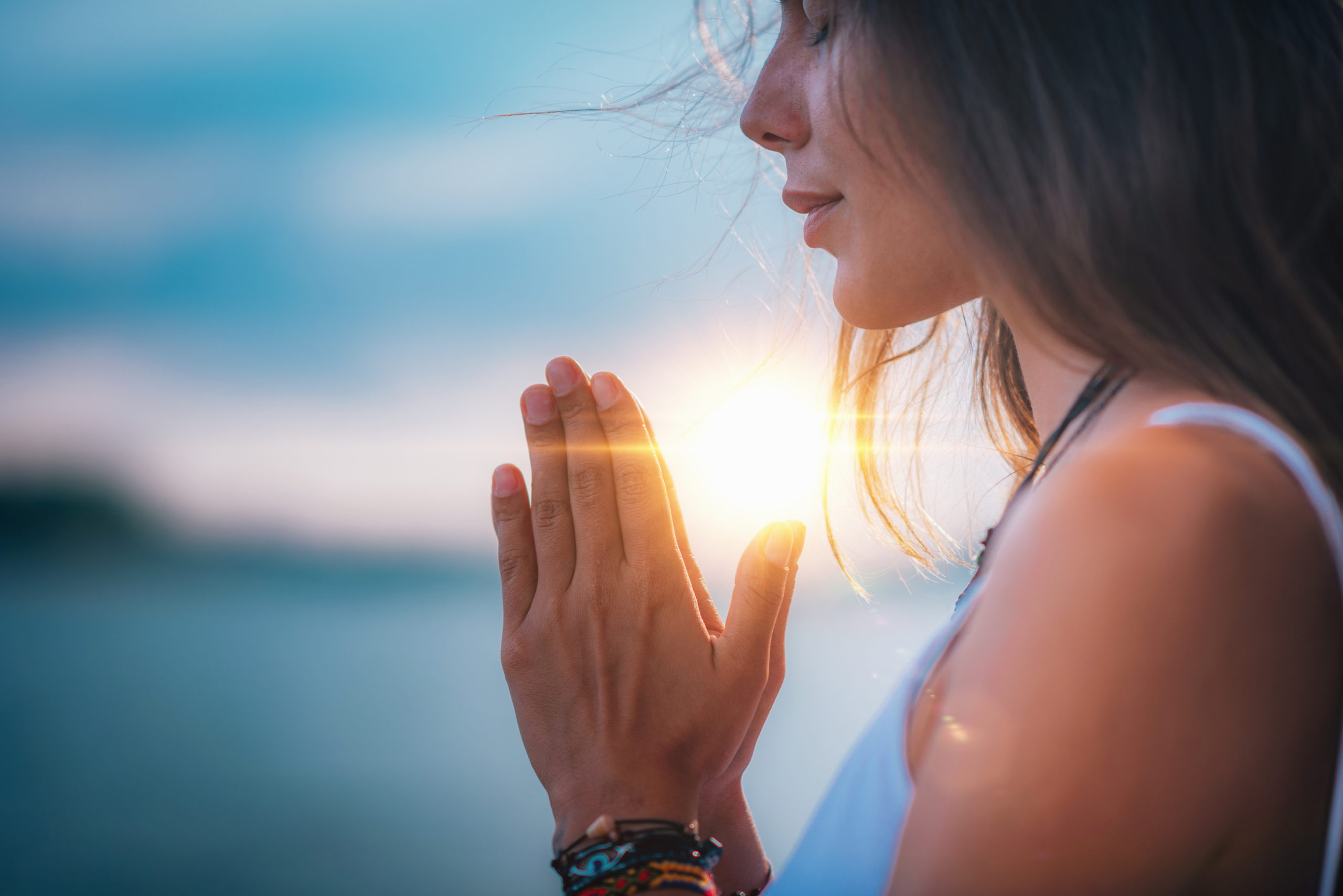 Young woman meditating with her eyes closed