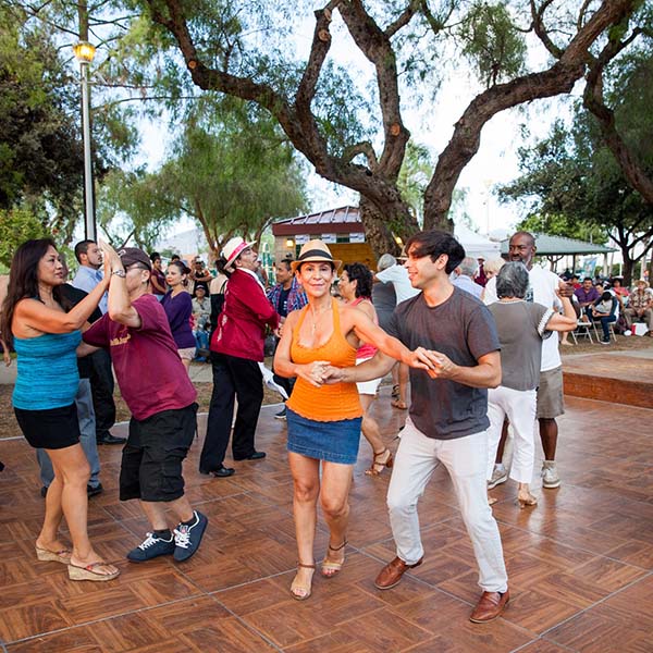 couples dancing on wooden floor outdoors