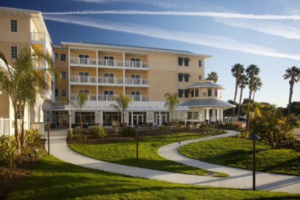 Grassy lawn in front of hotel building