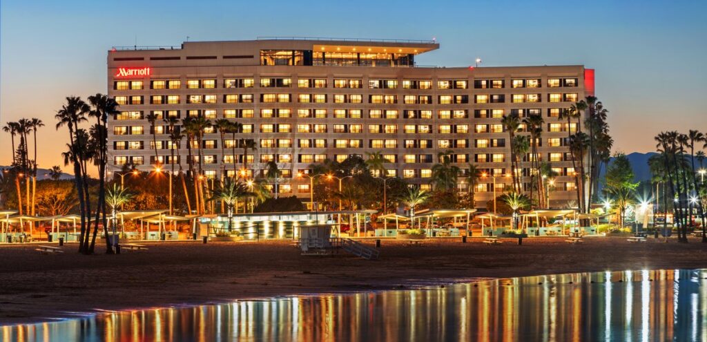 Evening view of large hotel in front of ocean