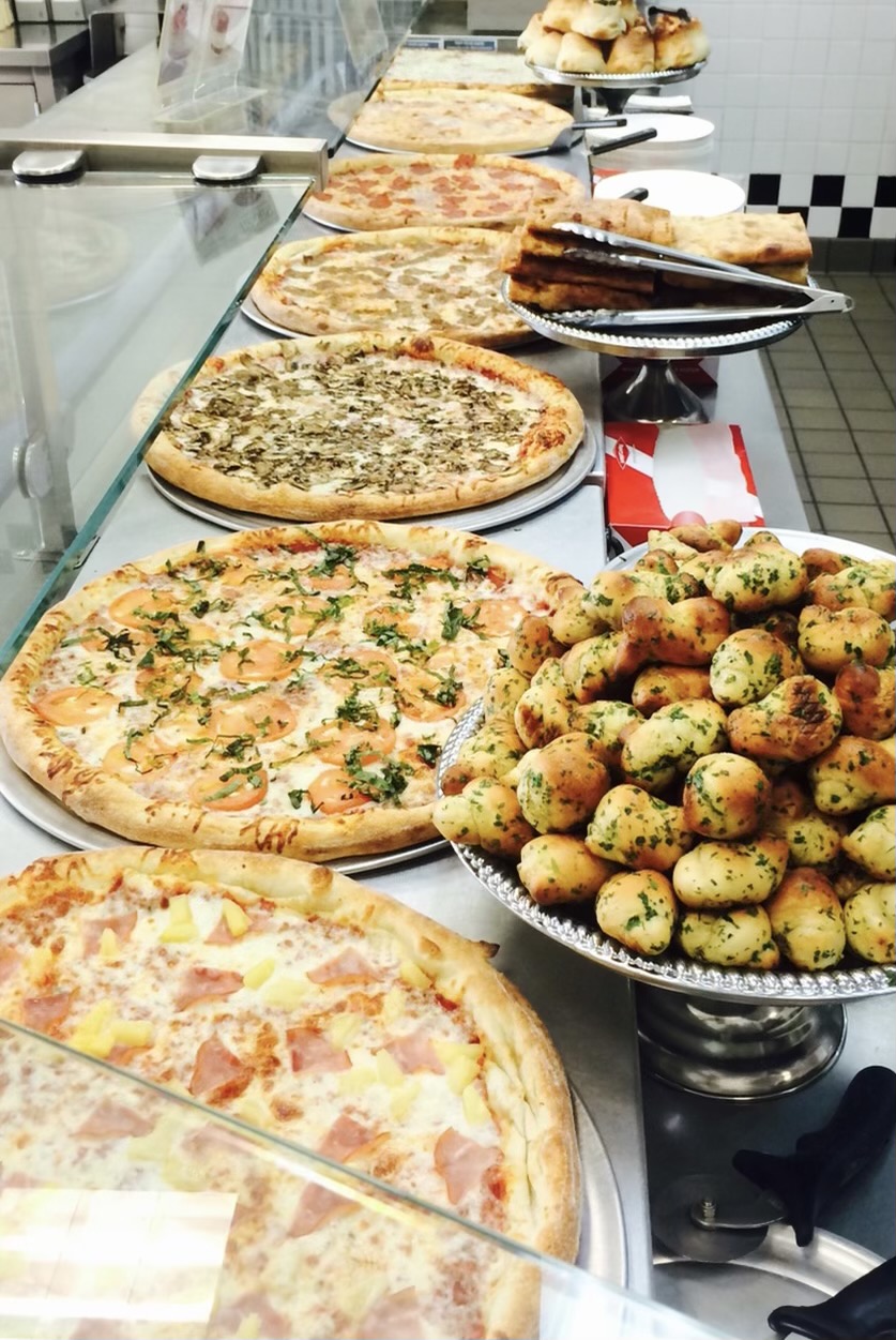 pizzas on a restaurant counter