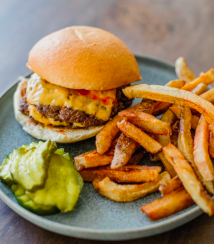 cheeseburger with fries and pickles